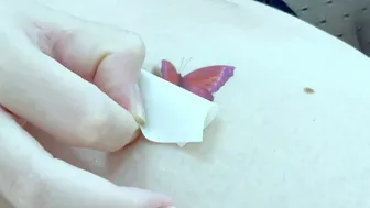 Elegance in Temporary Red Butterfly Body Art