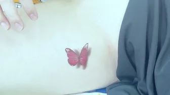 Elegance in Temporary Pink Butterfly Body Art